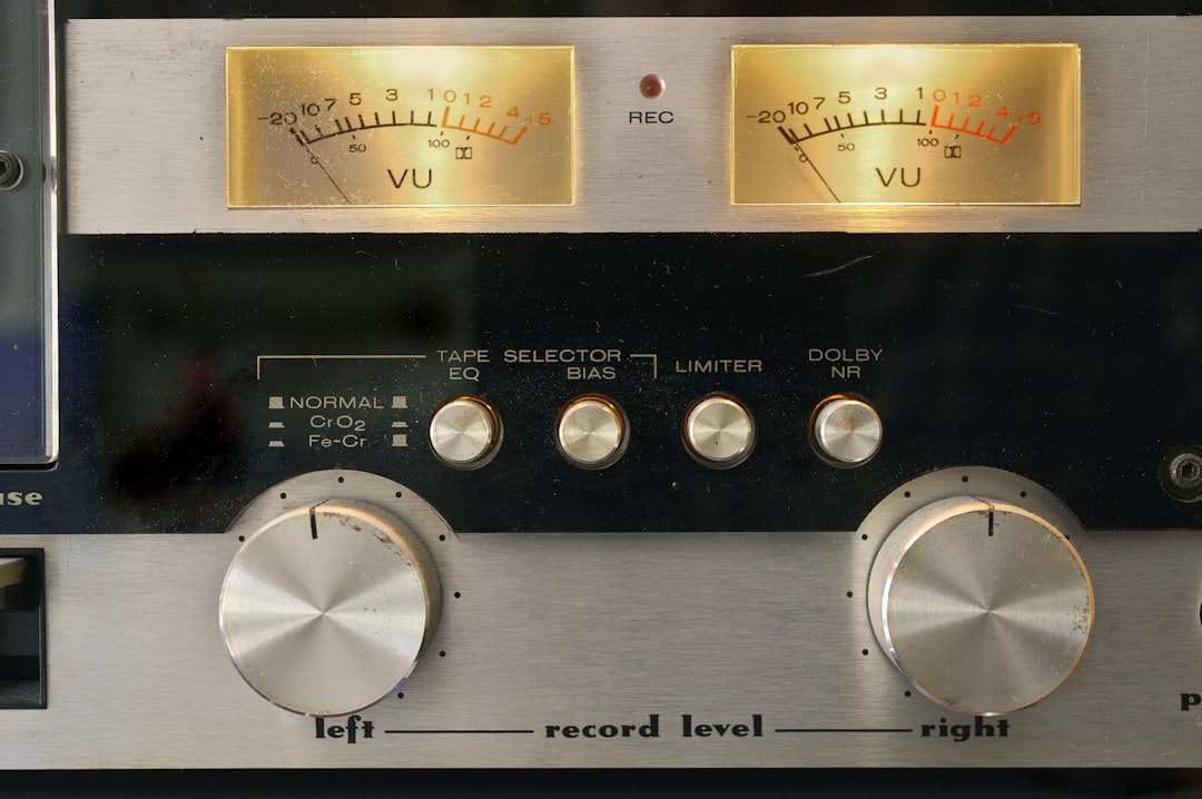 Close-up of vintage audio equipment showing VU meters and control knobs