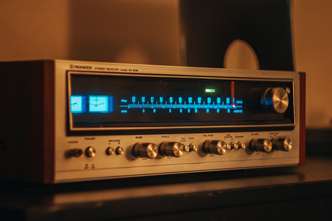 Close-up of a Pioneer vintage amplifier with control knobs and output terminals