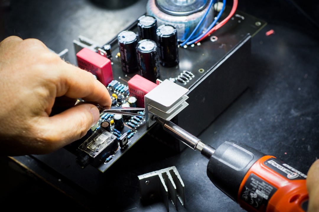 Interior circuit board of a vintage amplifier showing components and wiring
